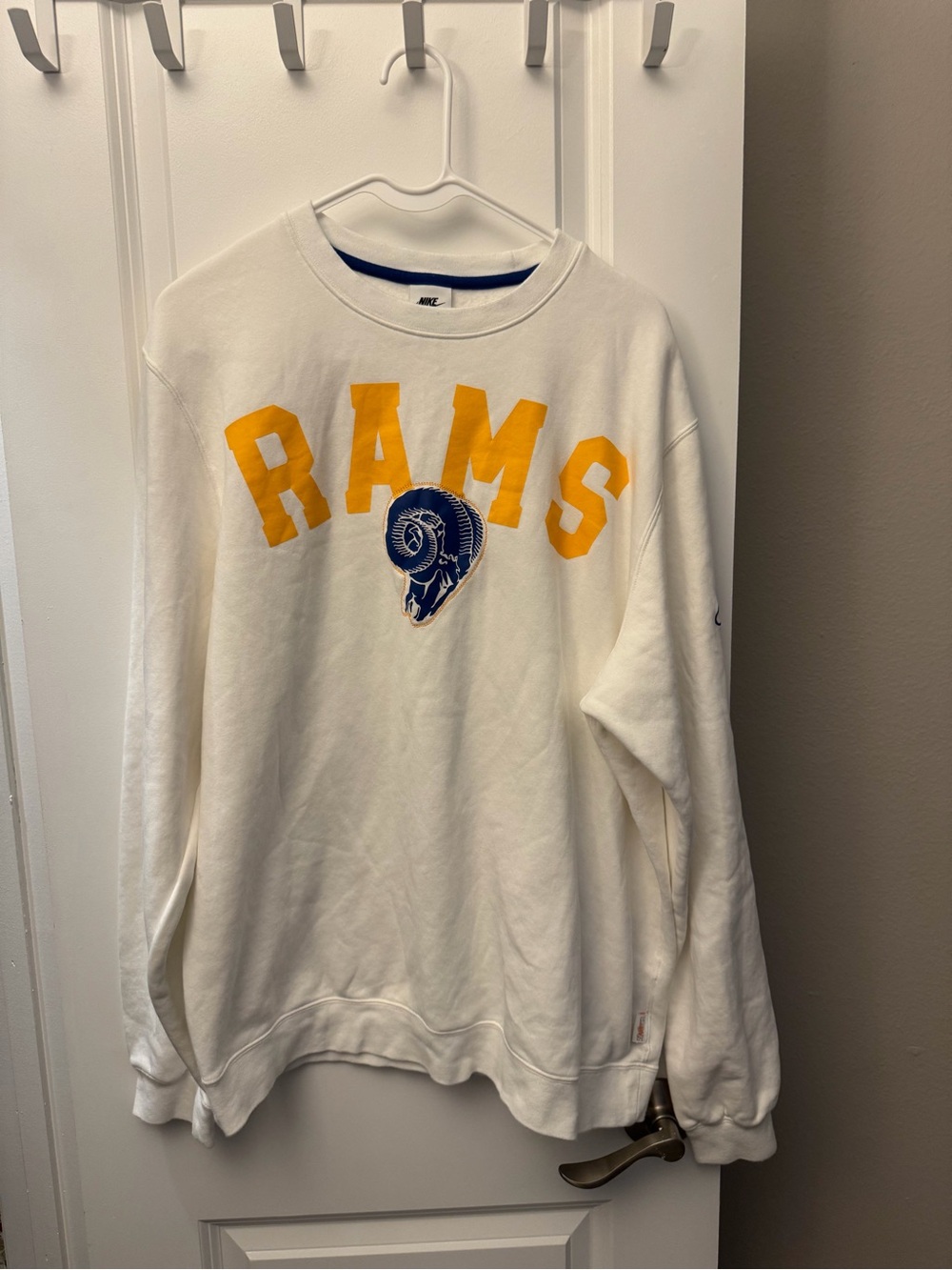 Nike White Crewneck Sweatshirt with Yellow 'RAMS' and Blue Ram Logo